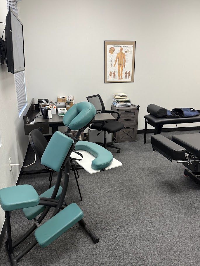 Treatment room with massage chair and adjusting tables
