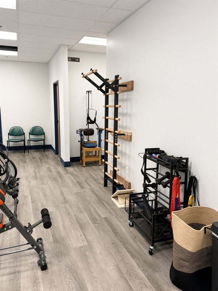 Stall bars, cervical traction station, balance board and weights rack